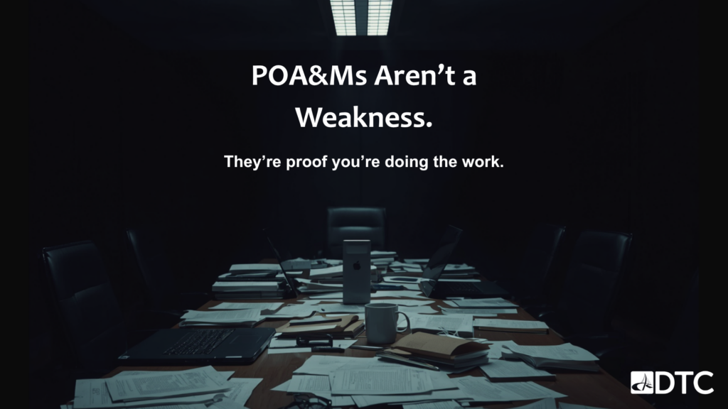POA&M compliance strategy — government contractor conference room with documents and laptops representing CMMC Plan of Action and Milestones